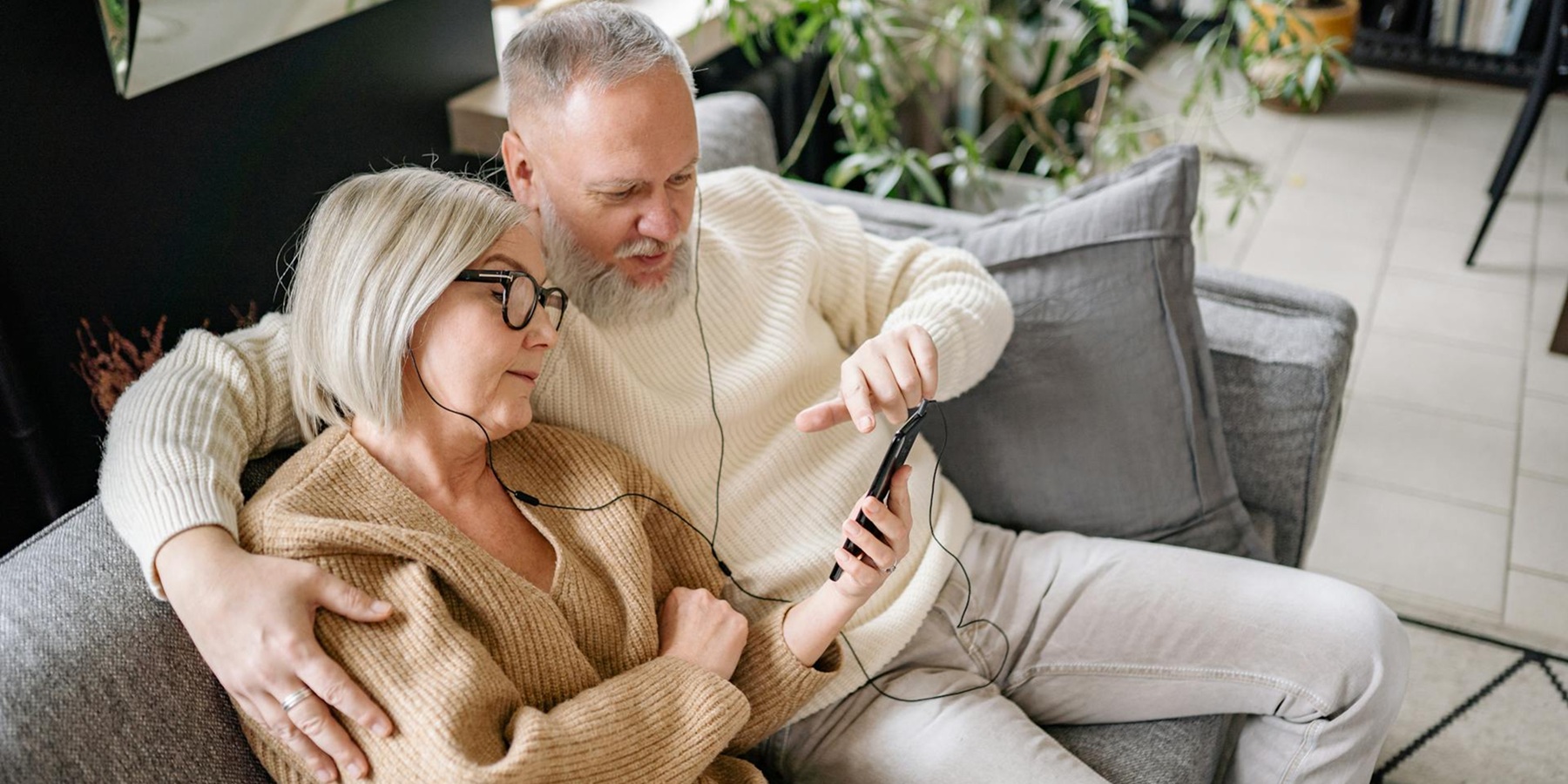 Two employees standing in front of their coffee shop